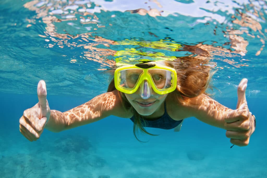 active young woman in snorkeling by Vacancy Rewards