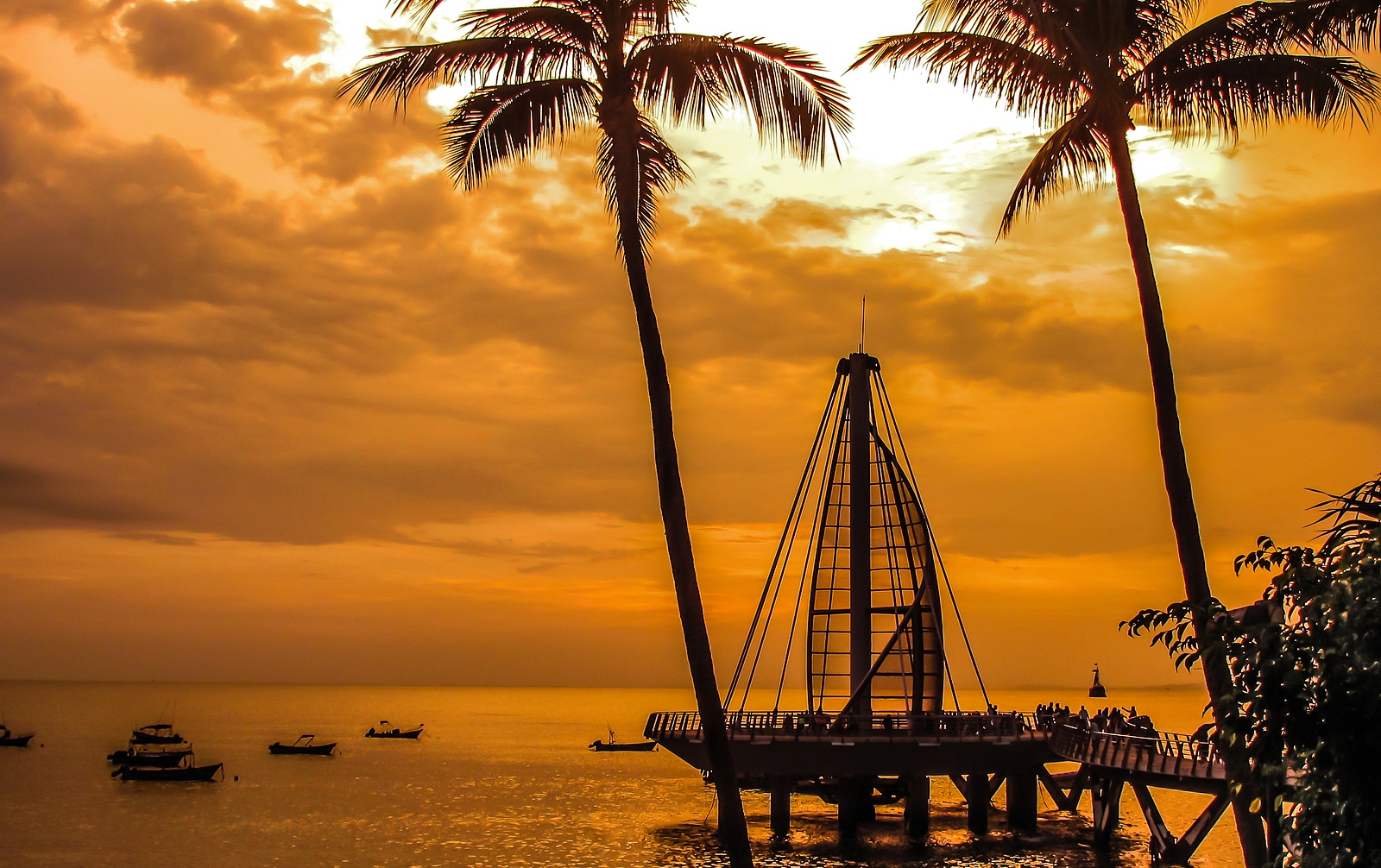 Los Muertos Pier during stunning Puerto Vallarta sunset. Los Muertos Pier during stunning Puerto Vallarta sunset.