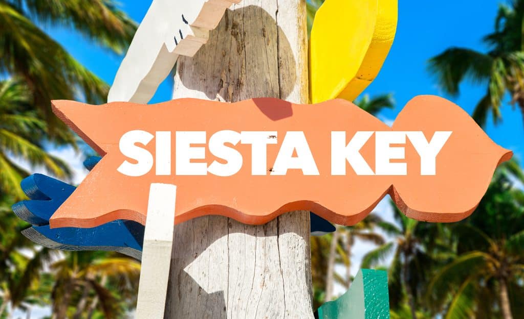 Siesta Key welcome sign with palm trees